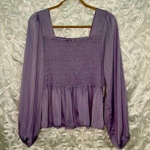 Brand new purple peplum blouse from Arula.